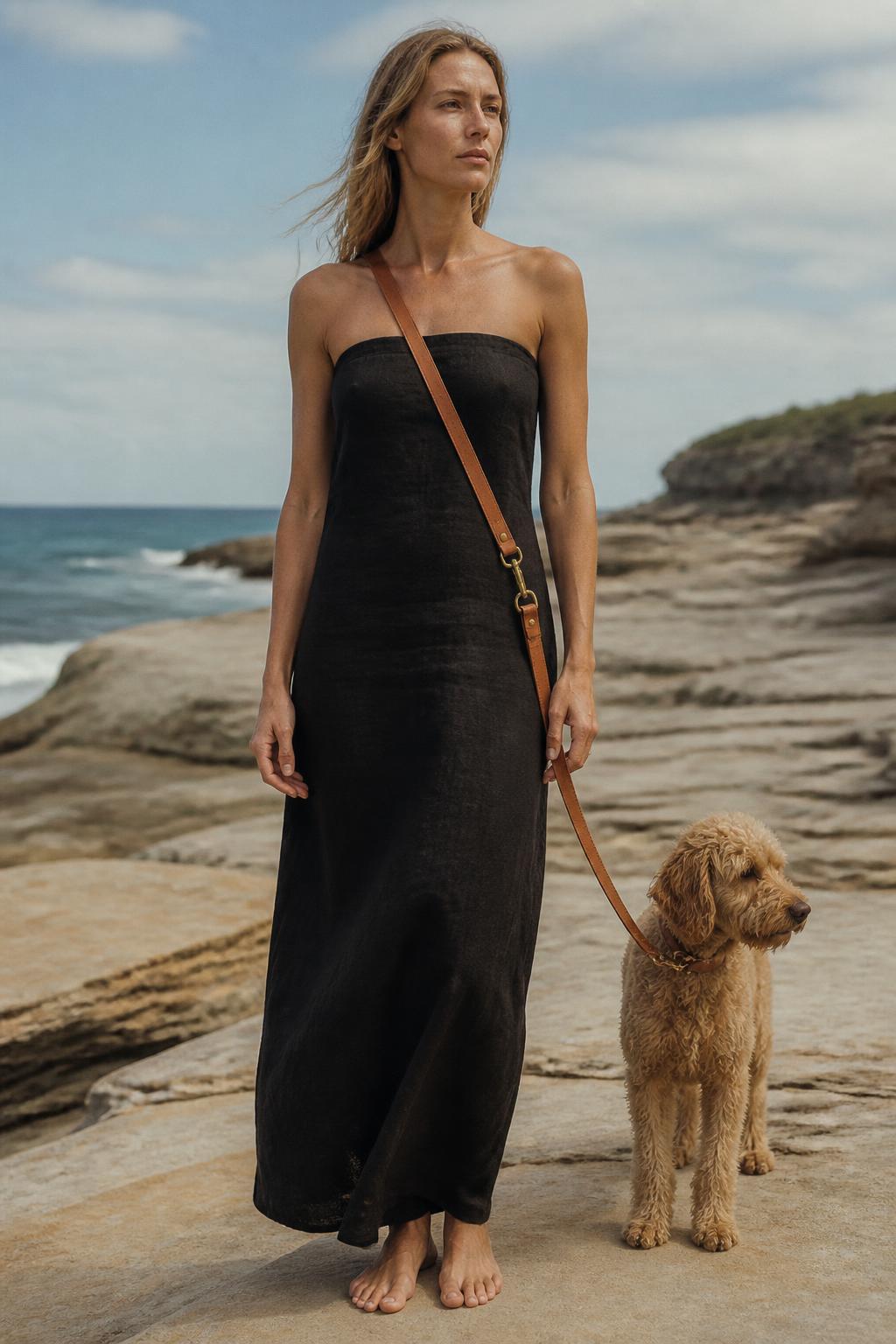 Editorial plate of the leash worn at the waist beside the dog